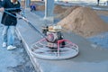 Construction worker grind the concrete surface after pour concrete Royalty Free Stock Photo