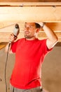 Construction worker with hand drill Royalty Free Stock Photo