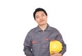 Construction worker hand holding yellow hard hat in front of white background Royalty Free Stock Photo