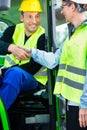 Construction worker hand shake with engineer on construction sit Royalty Free Stock Photo