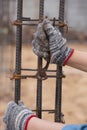 Construction worker hands working with pincers on fixin Royalty Free Stock Photo