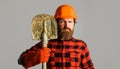 Construction worker in hard hat with shovel. Builder or workman in work gloves with spade. Royalty Free Stock Photo
