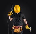 Construction worker in helmet with hammer and drill Royalty Free Stock Photo