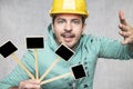 Construction worker holding a blackboard with space for text or text, copy space Royalty Free Stock Photo