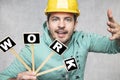 Construction worker holding a blackboard with space for text or text, copy space Royalty Free Stock Photo