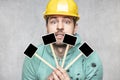 Construction worker holding a blackboard with space for text or text, copy space Royalty Free Stock Photo