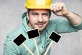 Construction worker holding a blackboard with space for text or text, copy space Royalty Free Stock Photo