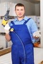 Construction worker holding electric perforator Royalty Free Stock Photo