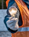 Construction worker holding light bulb Royalty Free Stock Photo