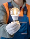 Construction worker holding light bulb Royalty Free Stock Photo
