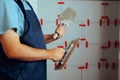 Construction Worker Holding a Margin and Square Notch Tool Royalty Free Stock Photo