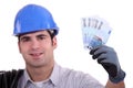 Construction worker holding money Royalty Free Stock Photo