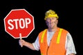 Construction worker holding stop sign