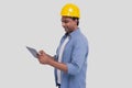 Construction Worker Holding tablet in Hands. Man Using Tablet. Architect Holding Tablet. Yellow Hard Helmet. Worker