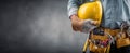The construction worker holding a yellow hard hat in a professional setting. AI generated image Royalty Free Stock Photo
