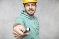 The construction worker holds the key in his hands, the key as a source of inspiration and ingenuity Royalty Free Stock Photo