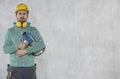 The construction worker holds a megaphone in his hands, the concept of issuing orders