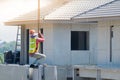 Construction worker are installing Crane hooks at the precast concrete wall, Precast house construction Royalty Free Stock Photo