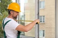 Construction worker installing new window Royalty Free Stock Photo