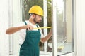 Construction worker installing new window Royalty Free Stock Photo