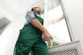 Construction worker installing new window Royalty Free Stock Photo