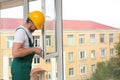 Construction worker installing new window Royalty Free Stock Photo