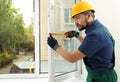 Construction worker installing new window Royalty Free Stock Photo