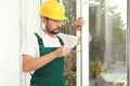 Construction worker installing new window Royalty Free Stock Photo