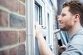 Construction Worker Installing New Windows In House Royalty Free Stock Photo