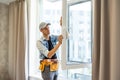 Construction Worker Installing New Windows In House Royalty Free Stock Photo