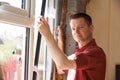 Construction Worker Installing New Windows In House Royalty Free Stock Photo