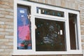 Construction Worker Installing New Windows In House