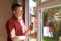 Construction Worker Installing New Windows In House Royalty Free Stock Photo