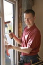 Construction Worker Installing New Windows In House Royalty Free Stock Photo