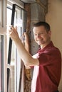 Construction Worker Installing New Windows In House Royalty Free Stock Photo
