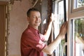 Construction Worker Installing New Windows In House Royalty Free Stock Photo