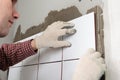 Construction worker installing tiles Royalty Free Stock Photo