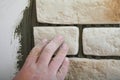 Construction worker installing tiles on a wall Royalty Free Stock Photo
