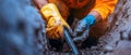 Construction Worker Installing Underground Utility Pipes Royalty Free Stock Photo