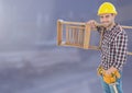 Construction Worker with ladder in front of construction site Royalty Free Stock Photo