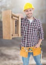 Construction Worker with ladder in front of construction site Royalty Free Stock Photo