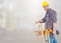 Construction Worker on ladder in front of construction site Royalty Free Stock Photo