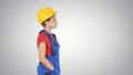 Construction worker lady walking emotionless on gradient background.