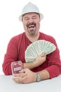 Construction worker laughing with vacations money Royalty Free Stock Photo