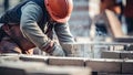 construction worker laying bricks on a construction site, close-up