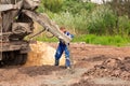 Construction worker laying cement or concrete into the foundation formwork Royalty Free Stock Photo