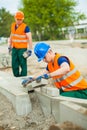 Construction worker laying cobblestones Royalty Free Stock Photo