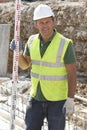 Construction Worker Laying Foundations