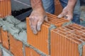 Construction worker laying hollow clay block 2