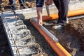 Construction Worker Laying Installing Sewer Pipes